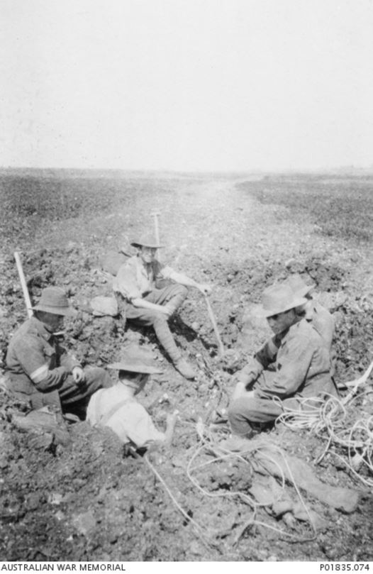 Men from the 2nd Divison Signal Company repair phone lines near Gilsy, France. 1918. Image courtesy of the Australian War Memorial https://www.awm.gov.au/collection/P01835.074